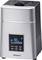 A silver air humidifier with a digital display shows 90% humidity and 25°C. Control buttons are located beneath the display.