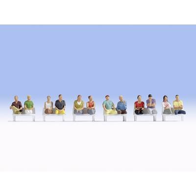 Twelve miniature figures sit on a row of benches, each wearing different clothing and in various poses, against a light blue background.
