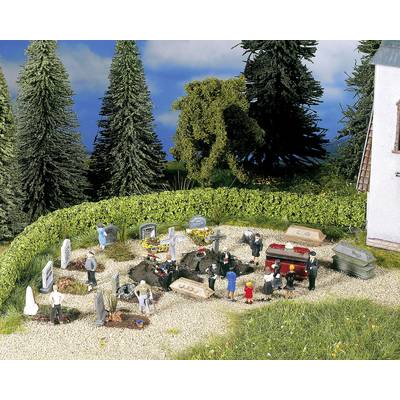A model funeral scene: Miniature people gather around graves, some figures wearing black suits, surrounded by trees.