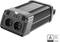 A black voltage converter with two plug sockets and USB ports, TÜV-certified, placed on a light surface.