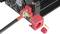 A red plastic plug is being pulled out from a black device connected to a cable. A fan is located on the device.