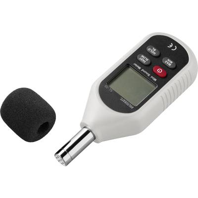 Sound level meter with display and control buttons, microphone cover beside it. Used for measuring noise levels.