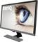 A BenQ computer monitor displays a close-up photograph of a blue eye.