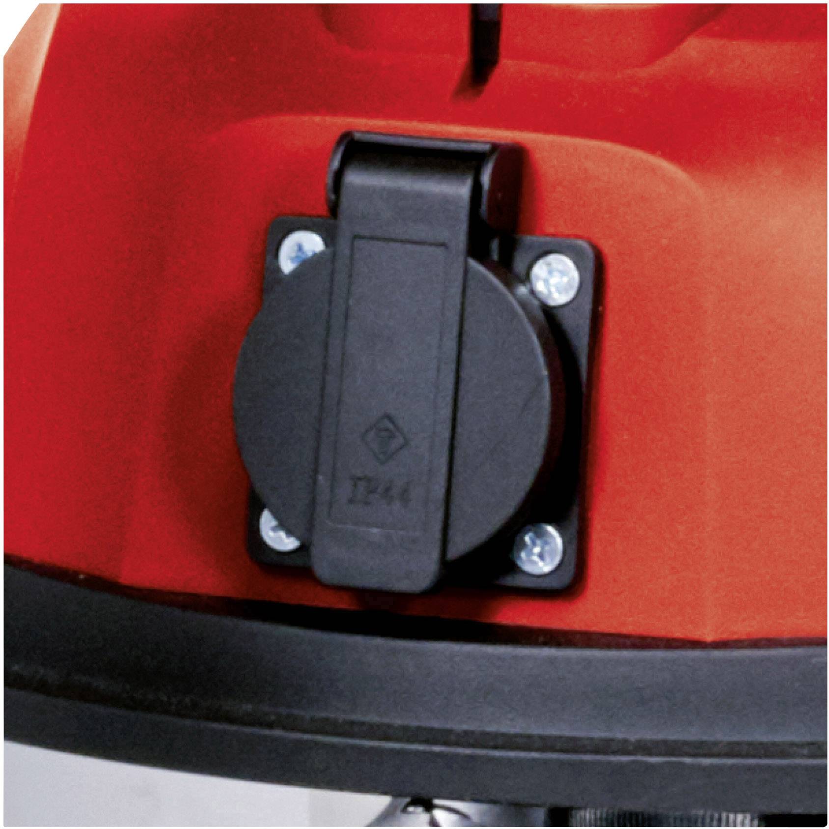 A round, black socket on a red device, secured with four screws.