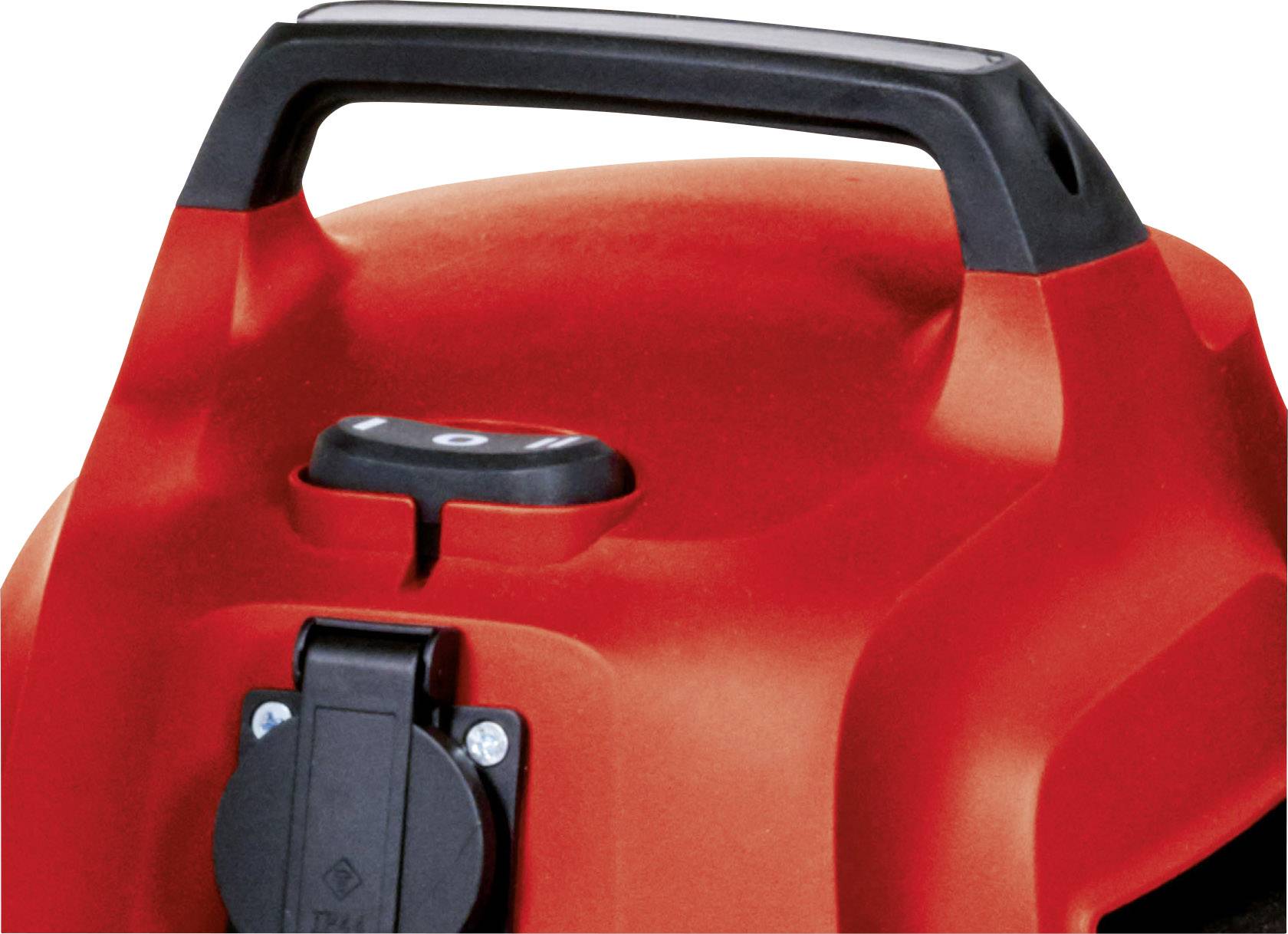 Red vacuum cleaner with black handle and socket on the top surface.
