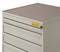 Metal drawer cabinet with five drawers and warning sticker in the top right corner. Ideal for tool storage.