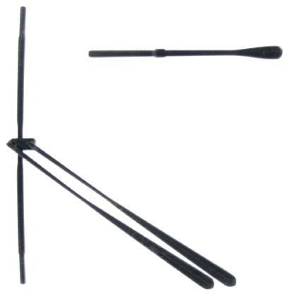 Two black cooking utensils: a whisk on the left in the middle and a mixing stick hovering above.