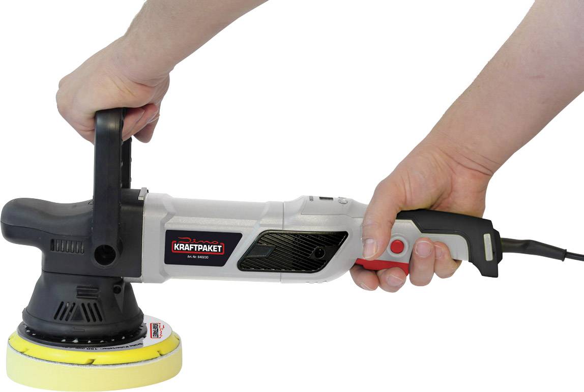 A hand is holding a polishing machine with a black handle and yellow polishing head. The brand 'Kraftpaket' is visible on the machine.