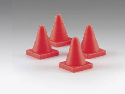 Four small red traffic cones are evenly distributed across a grey surface.