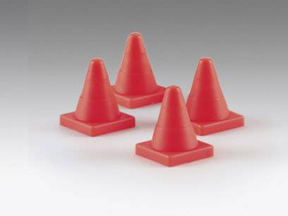 Four red plastic traffic cones are positioned in a rectangle on a smooth surface.