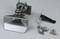 'Metal component with hinge' on the left of the image, surrounded by small screws and nuts.