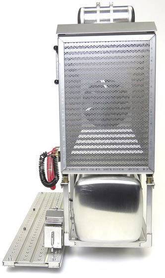 Metallic mechanism with a perforated front plate, beneath it a gleaming tank and cables at the side on a metallic base.