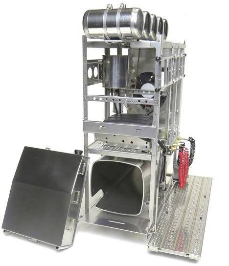 An open metal structure for transporting rockets. Shows chambers, mountings, and special holding devices.