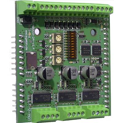 Electronic circuit board with green connectors, integrated circuits, and capacitors. Used for motor control.