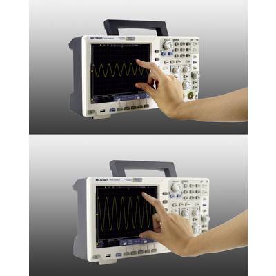 A person is using a digital oscilloscope to check and analyse wave-like signals on the screen.