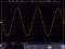 'Oscilloscope display of a sine wave, X-axis: Time in ns, Y-axis: Voltage in mV. Shows periodic voltage fluctuations.'