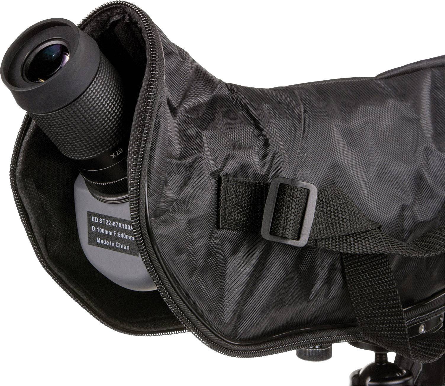 A telescope with a black protective cover is partially open, revealing the eyepiece. It is mounted on a tripod.