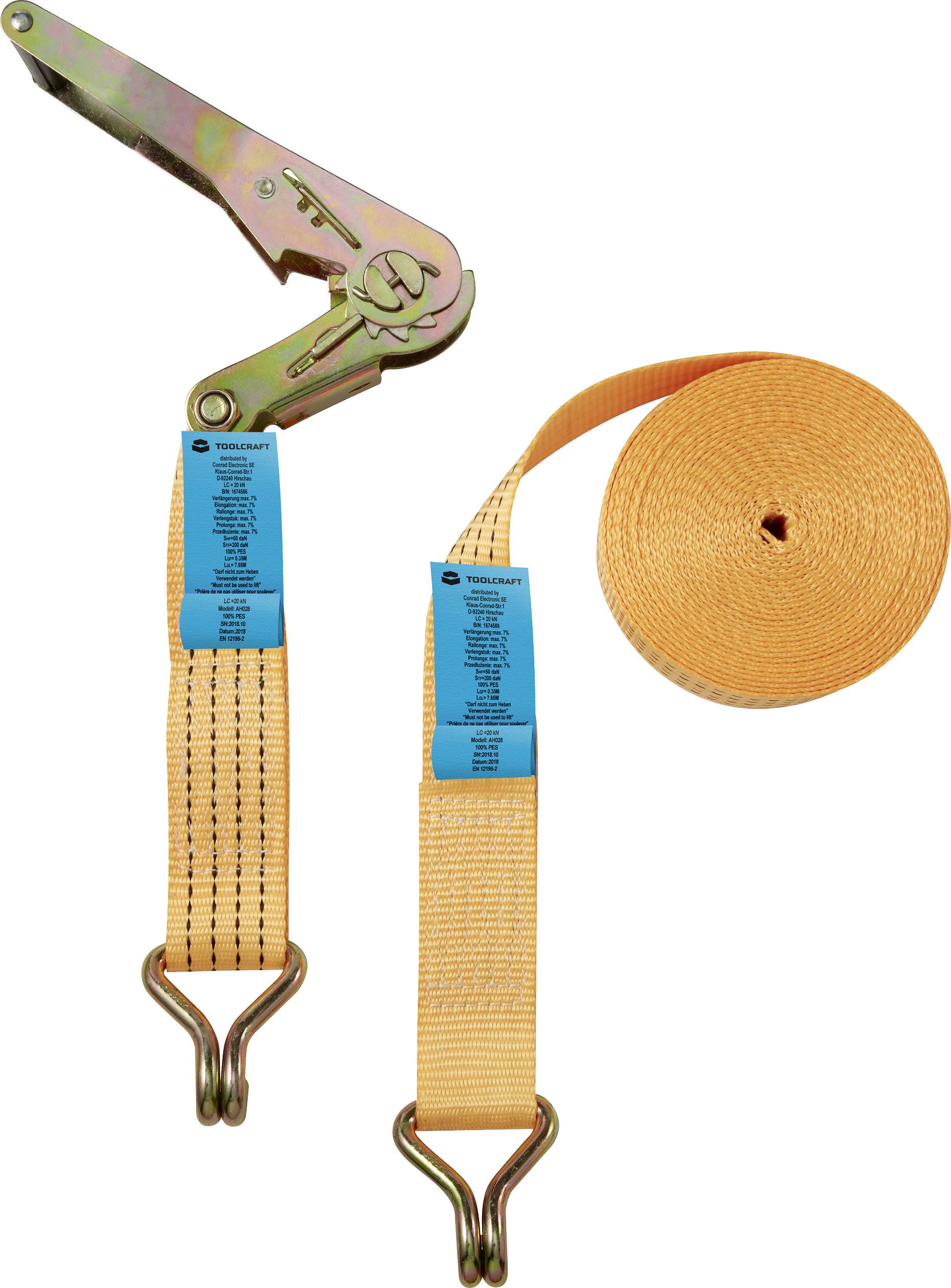 A yellow ratchet strap with metal hooks, along with a coiled section of the strap, is lying on a white background.