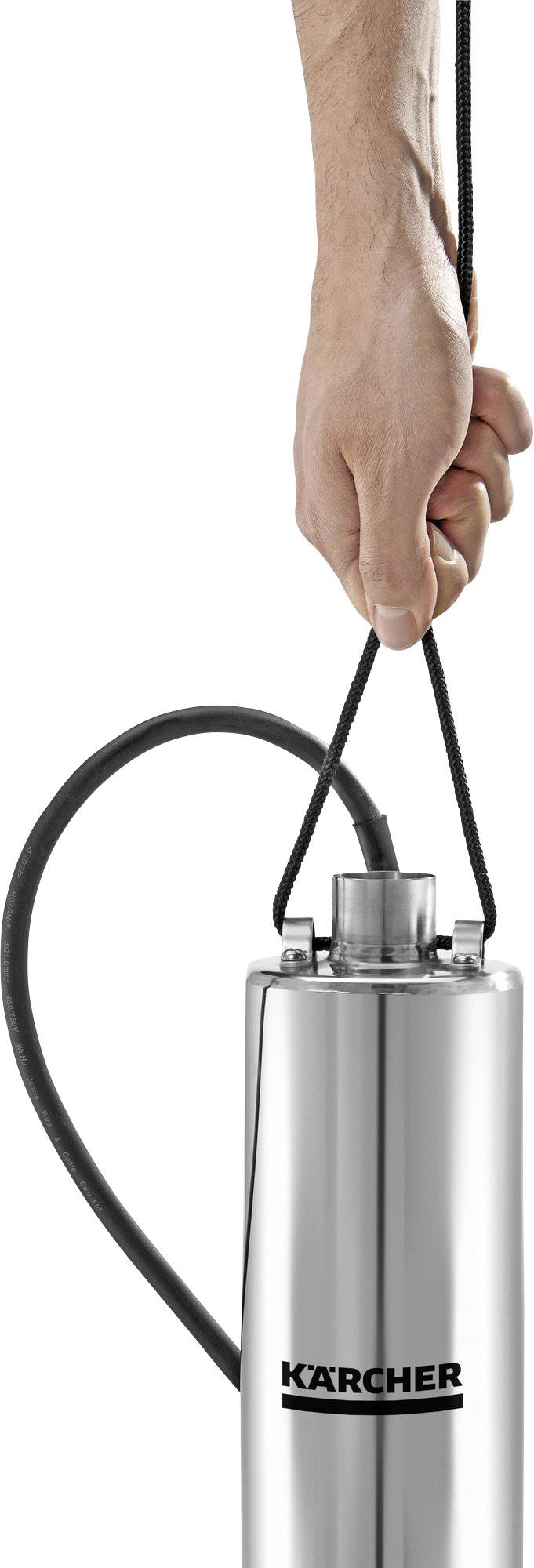 A hand is holding a silver, cylindrical pressure washer, Kärcher brand, with a black hose at the top of the device.