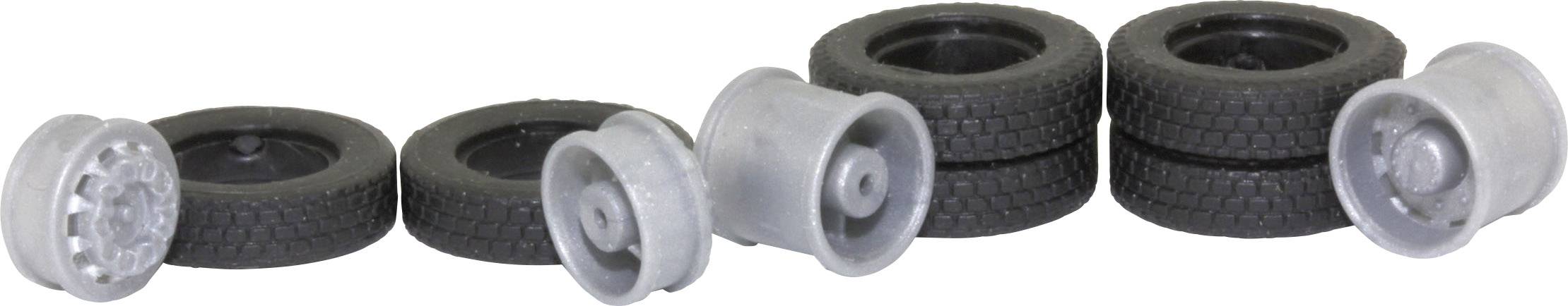 'Four miniature tyres and three grey rims in various arrangements'