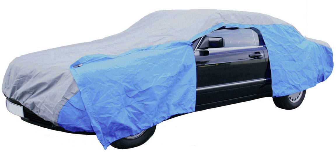 A car, which is protected by a semi-transparent blue cover, is parked in a car park.
