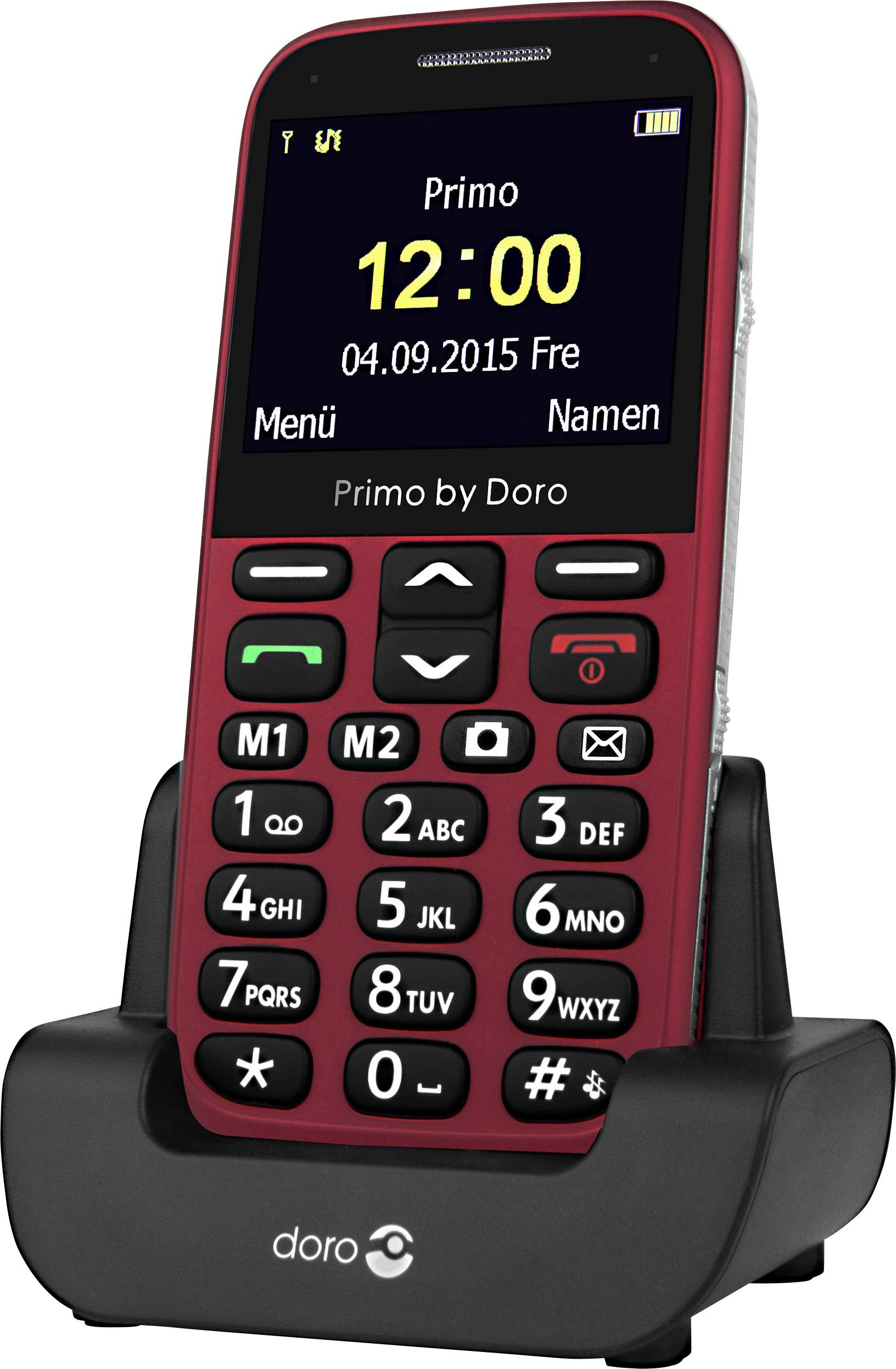 A red mobile phone for seniors with large buttons sits in a black charging station. The display shows the time and date.