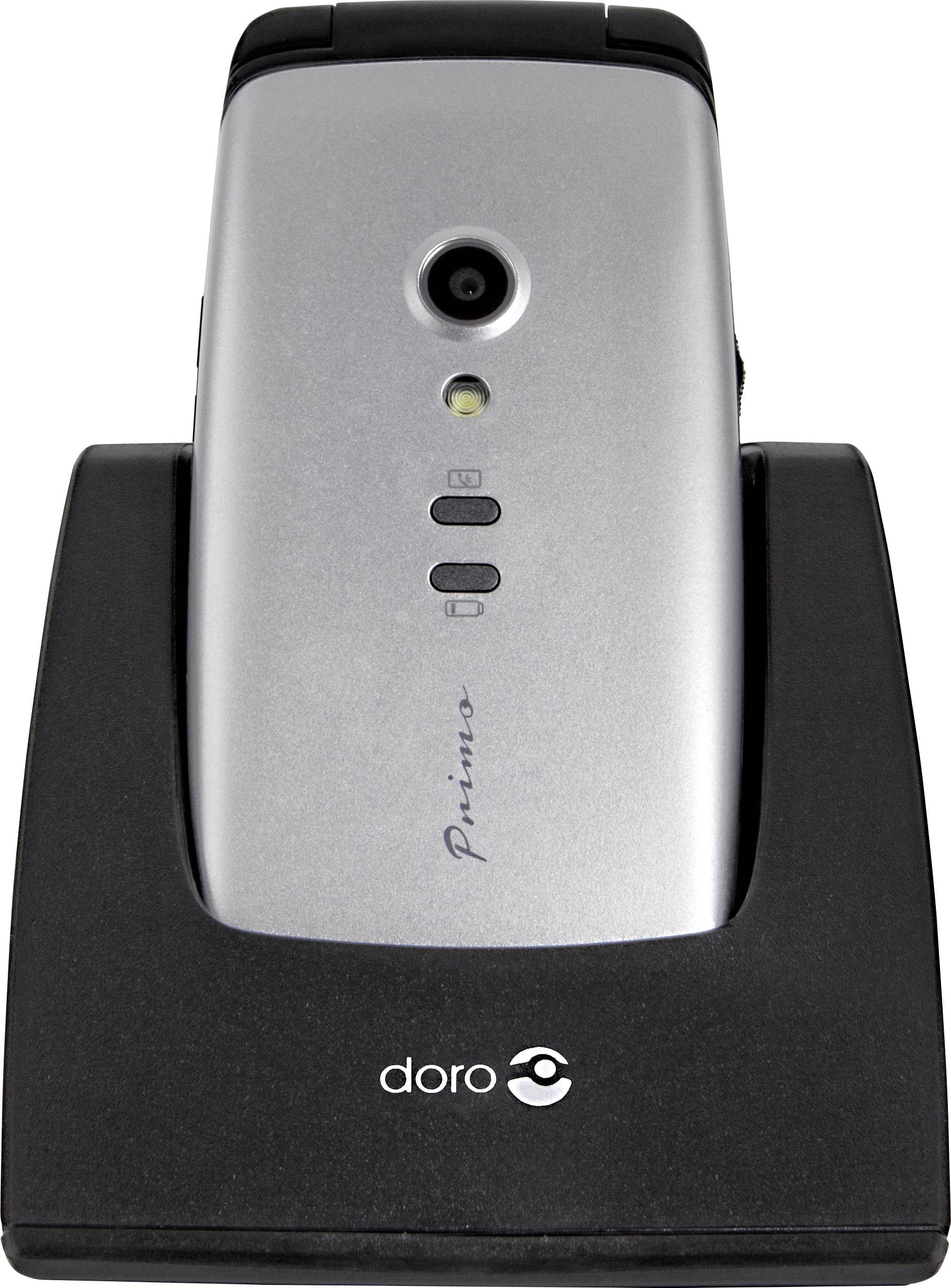 Mobile phone on charging dock, camera and buttons visible. Brand name 'Primo' recognisable. Mobile phone is being charged.