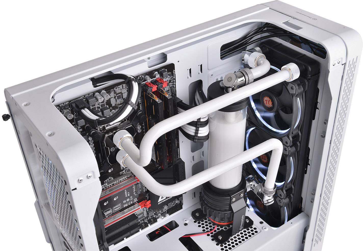 An open computer displays a complex water cooling system with white tubes and multiple fans.