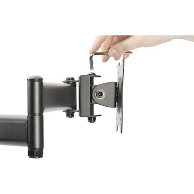A hand tightens a screw with an Allen key on the articulated arm of a monitor mount.