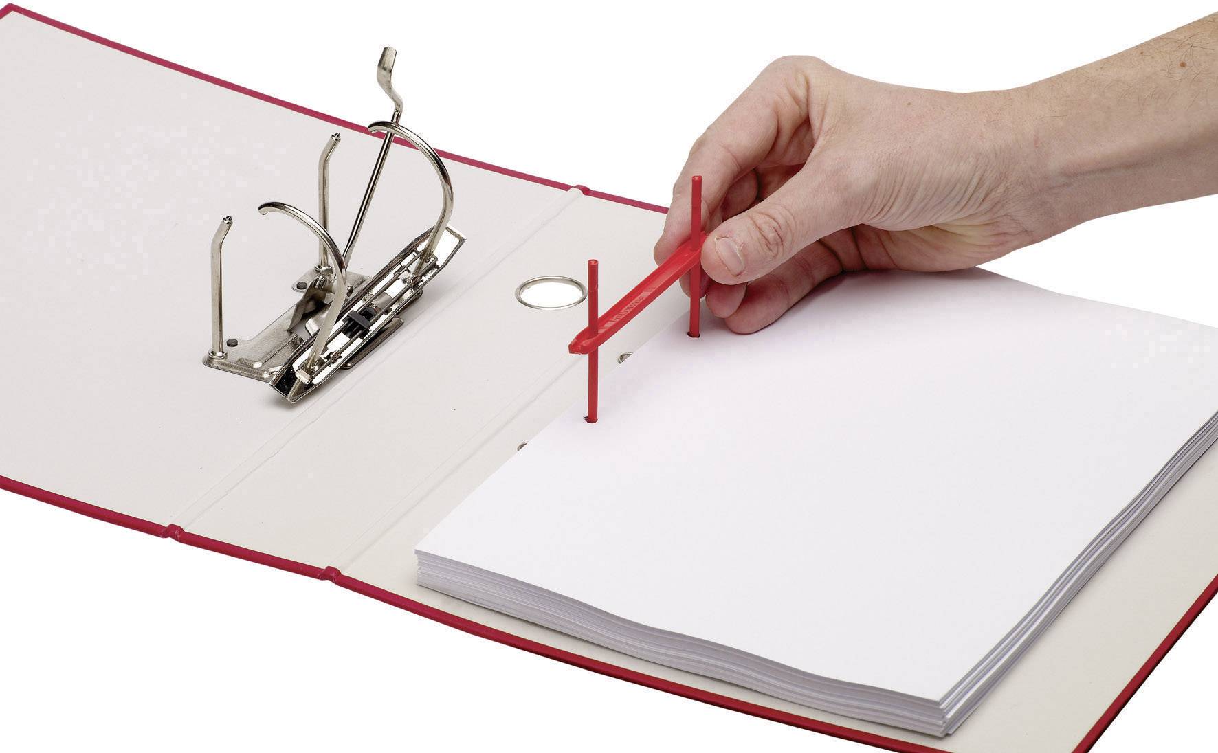 A hand is placing papers into a red lever-arch file