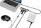 A laptop is connected to a USB hub, which has an external hard drive, two USB drives, and a computer mouse plugged in.