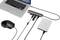 A laptop is connected to a USB hub, to which a mouse, an external storage device, and USB drives are connected.