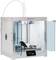 A 3D printer with open doors shows an ongoing print job. The display shows controls and information about the print status.