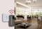 Intelligent plug in wall unit; sends Wi-Fi signals. Modernly furnished living room with sofa and kitchen area in the background.