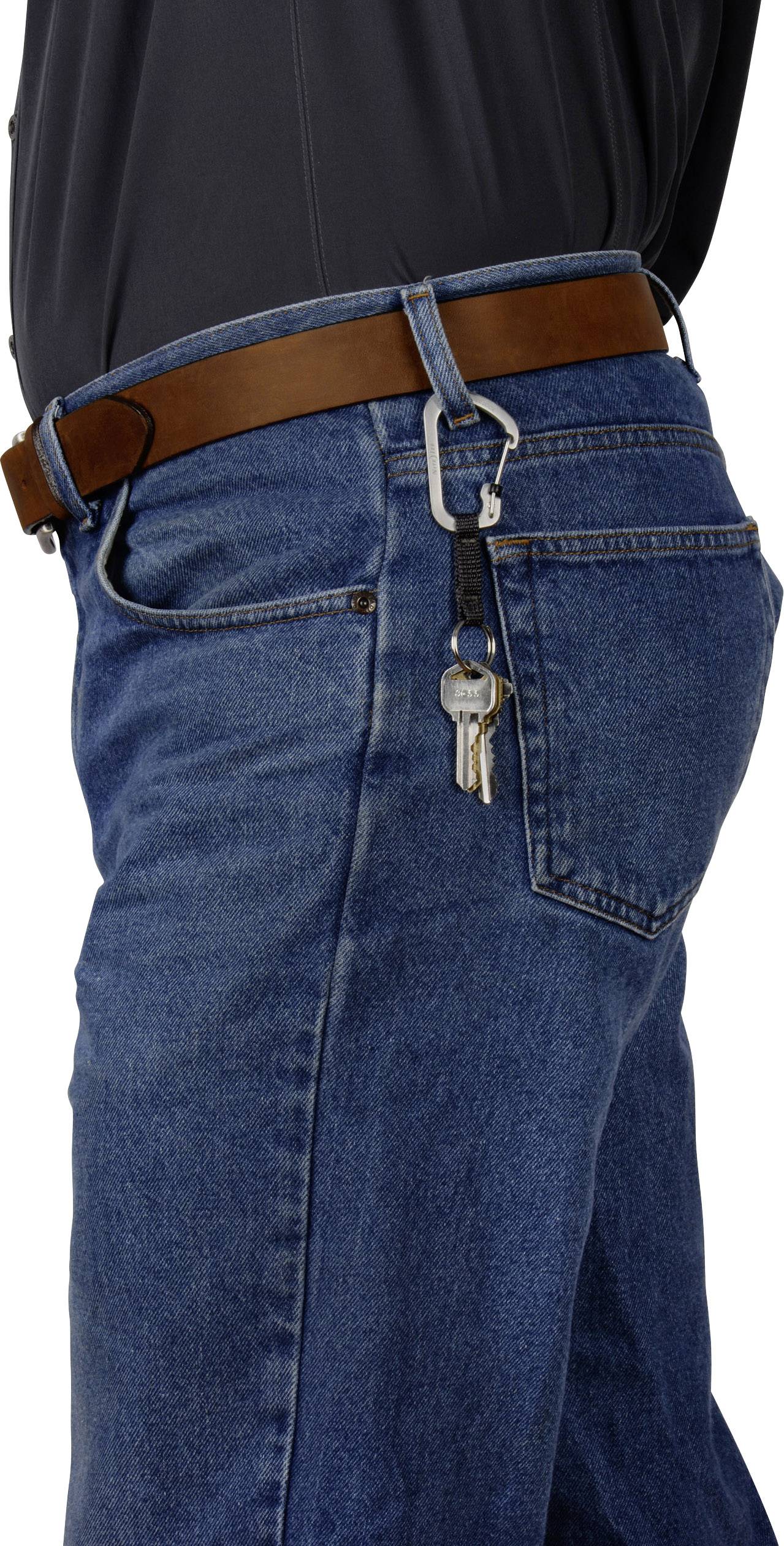 A man is wearing blue jeans with a brown belt. A bunch of keys is hanging from one of the belt loops.