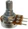 A four-terminal electric potentiometer with a rotatable shaft.