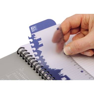 A hand is holding a transparent ruler attached to a blue divider in a spiral-bound notebook.