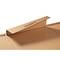 Open cardboard box with flap raised, lying on a white surface.
