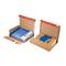 Two open shipping boxes with blue ring binders. Boxes are made of brown cardboard with red sealing tape.