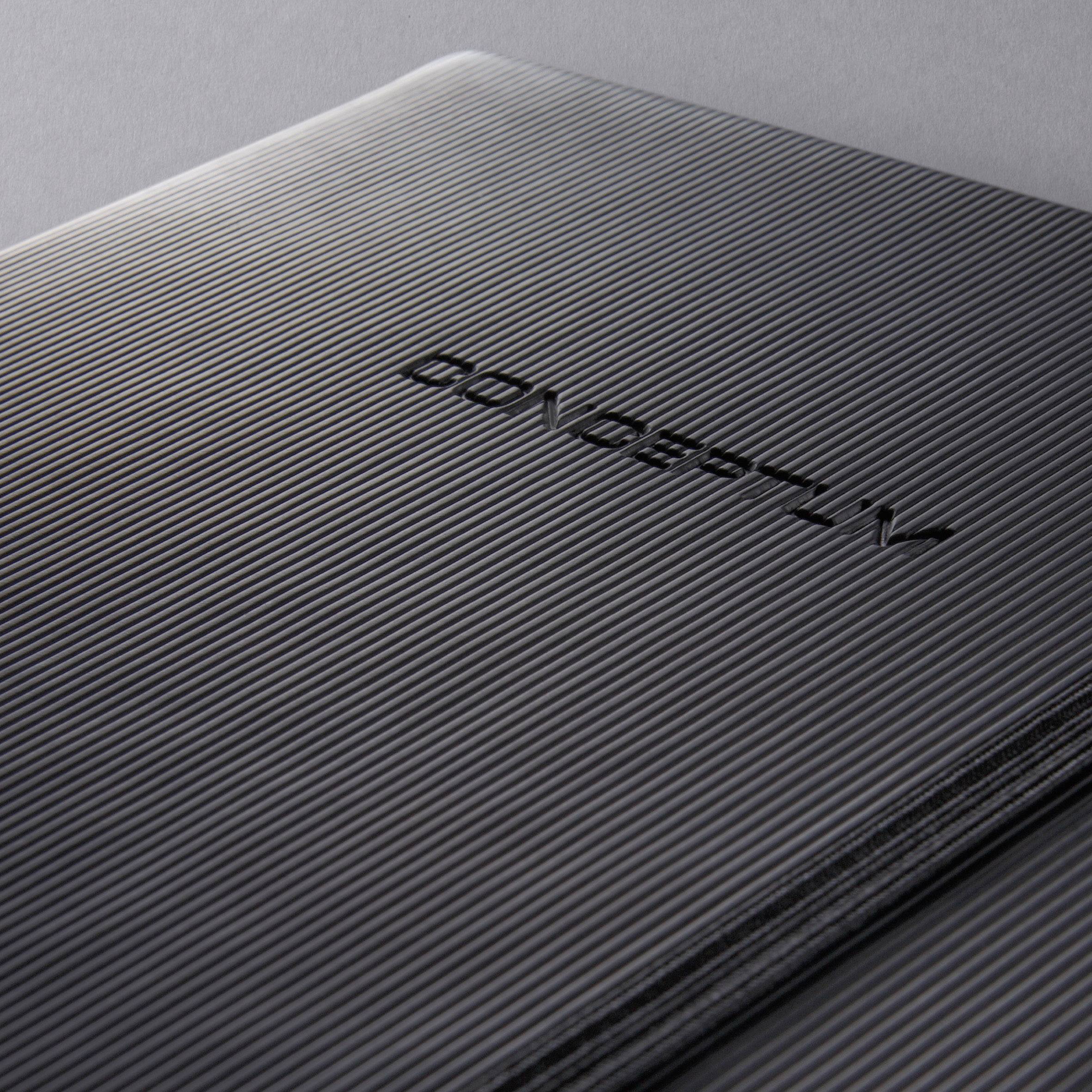 Close-up of a grey, ribbed surface with the embossed marking 'CONCEPTD'.