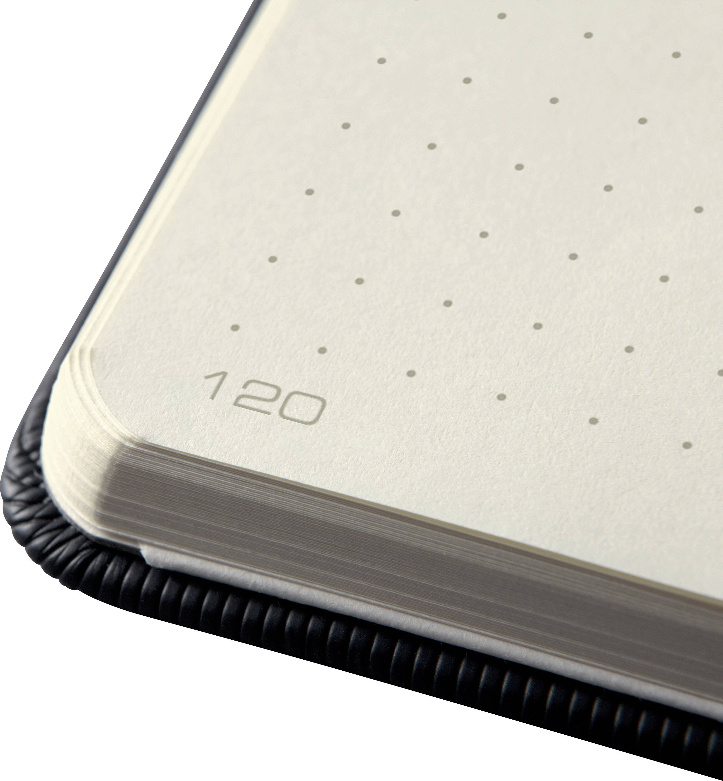Corner of an open notebook with a dotted grid pattern and page number '120', showing high-quality paper texture.