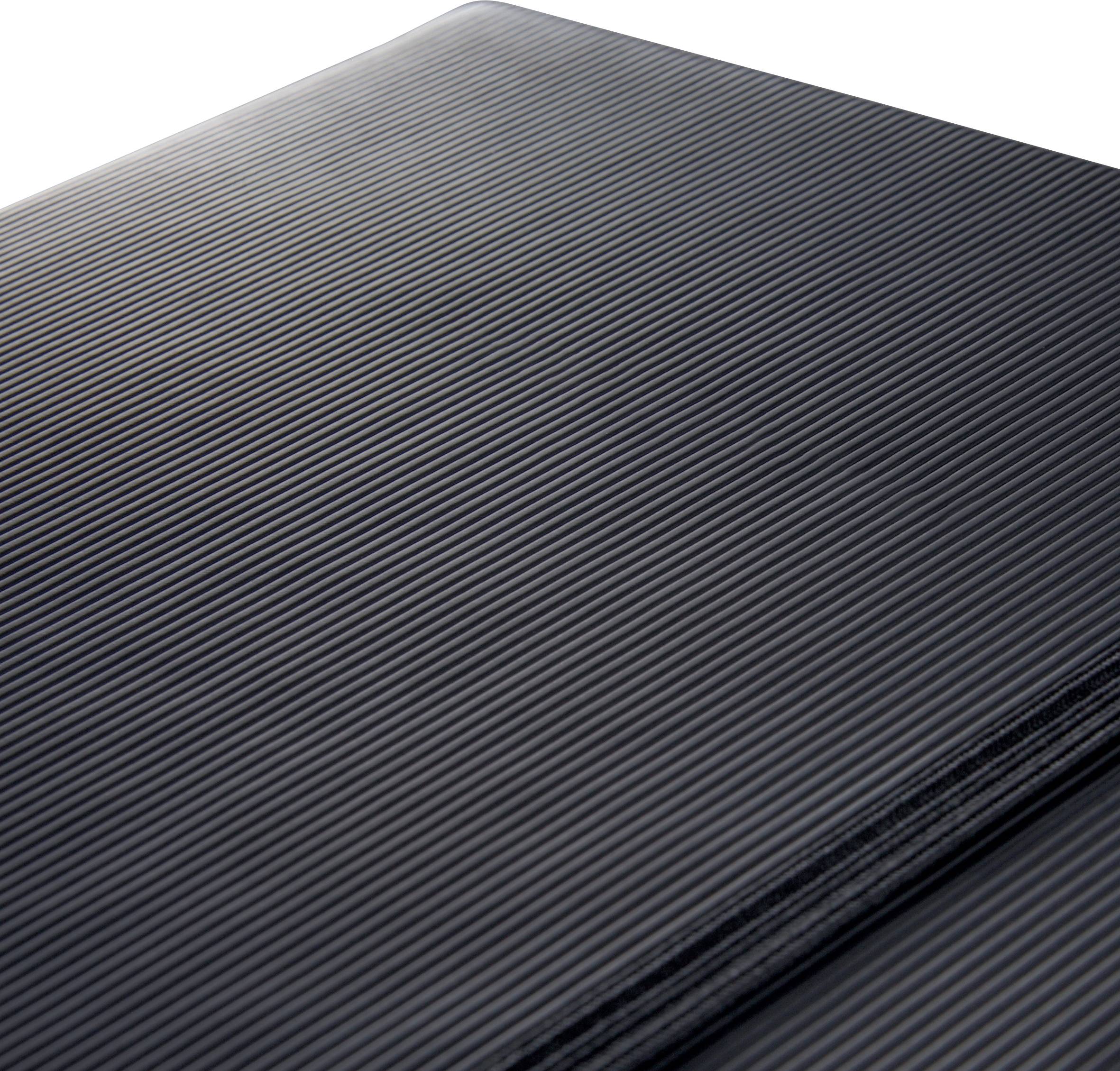 Black, ribbed texture of a surface material showing a detailed view of a technical or industrial product.