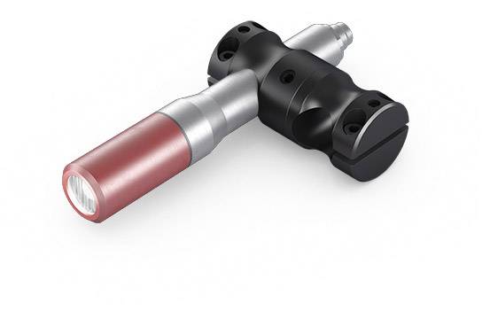 A black handle with a red tip, possibly a specialised tool or handle piece.