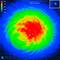 A thermal imaging scan shows a bright red-yellow zone in the centre, transitioning from blue to green and finally to red. Scale: 500 micrometres.