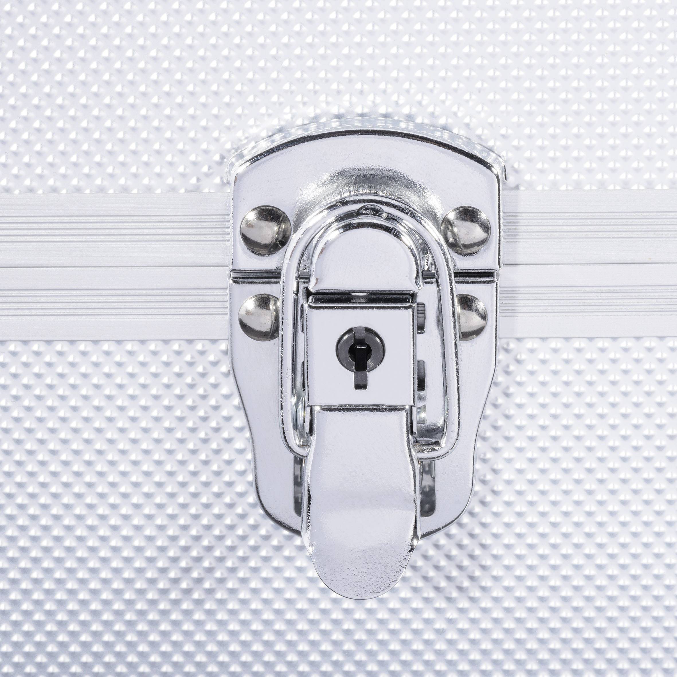 Metal padlock on a textured metal surface of a box. The shiny lock is positioned centrally.