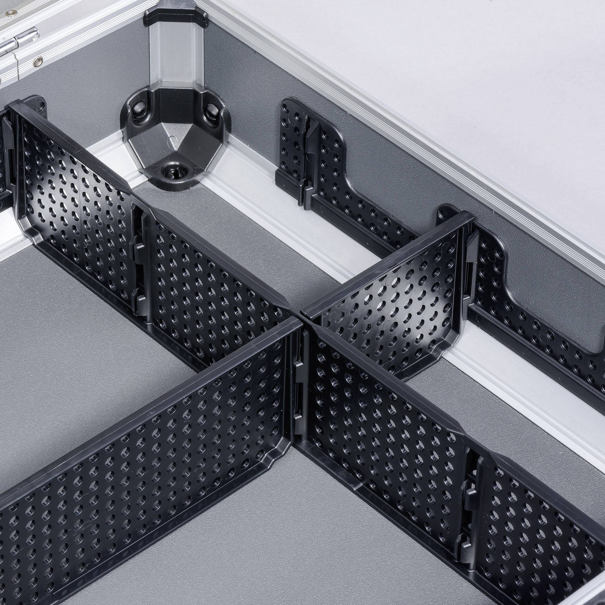 'Black, adjustable plastic dividers in a silver hard-shell case provide flexible compartment customisation.'