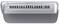 Ventilation slots on a silver-coloured device, possibly a laptop, with a central button visible on the top surface.