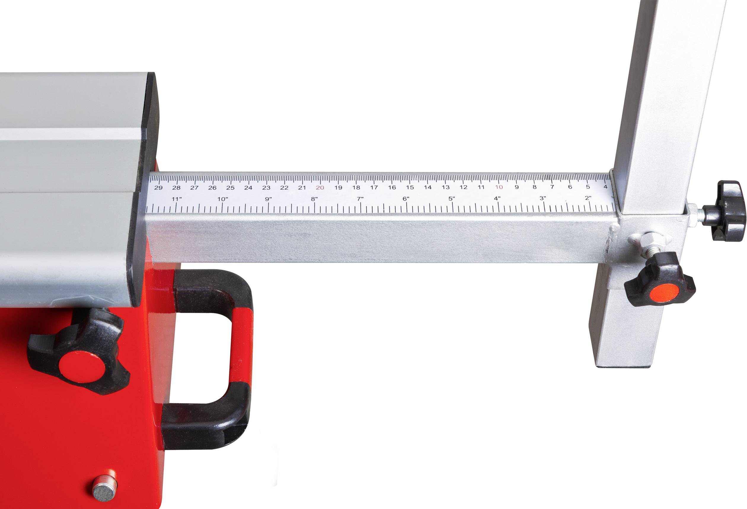 A red device with a black handle and scale display, likely a tool for precise measurement or adjustment.