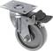 Swivel castor made of metal and plastic with a locking brake, mounted on a smooth surface. Ideal for movable furniture.