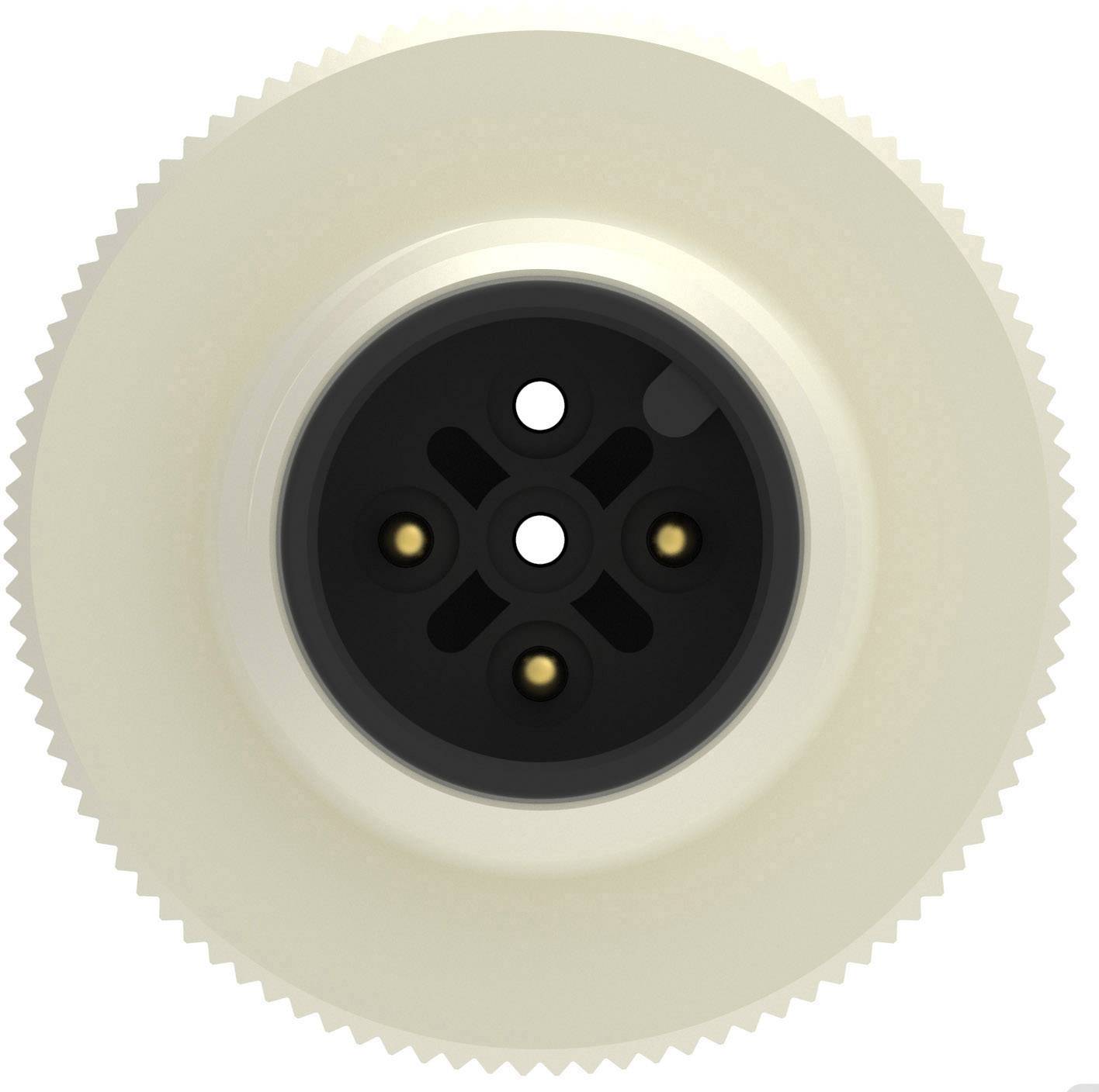 Close-up of a round, beige plug with black holes and golden contacts in the centre.